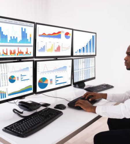 Intern Hub: Opportunities and Professional Services for Job Seekers young businessman analyzing financial chart on multiple computers in office