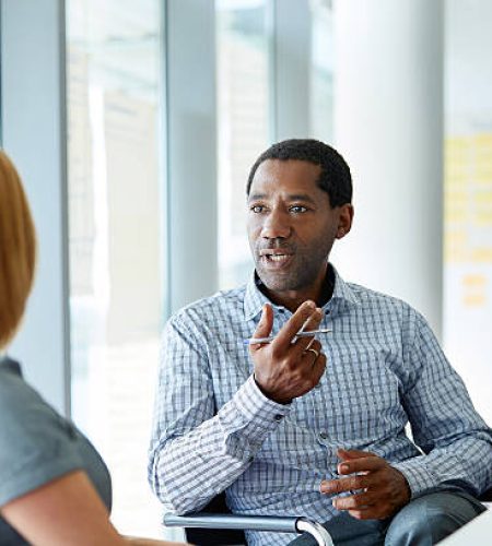 For Employers shot of two colleagues talking together in a modern office
