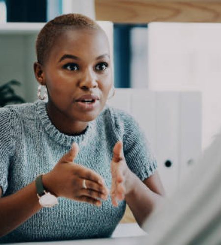 shot of a young businesswoman having a discussion with a colleague in an office