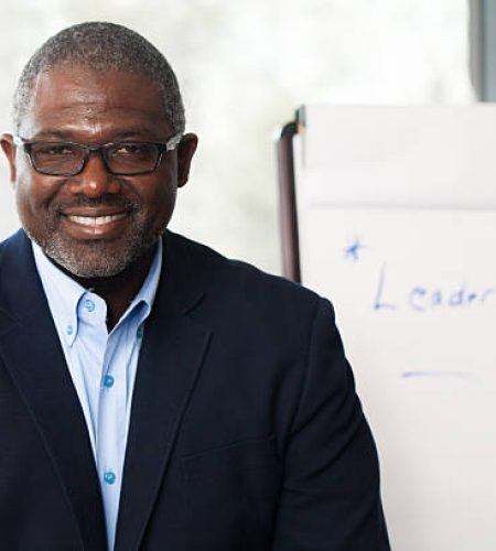 For Employers african american businessman giving presentation on leadership