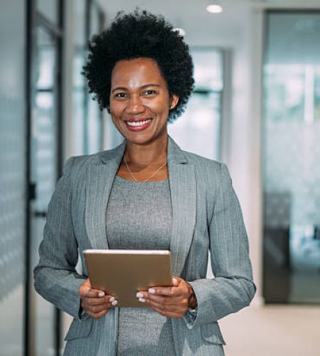 shot of beautiful smiling businesswoman holding digital tablet in the office.